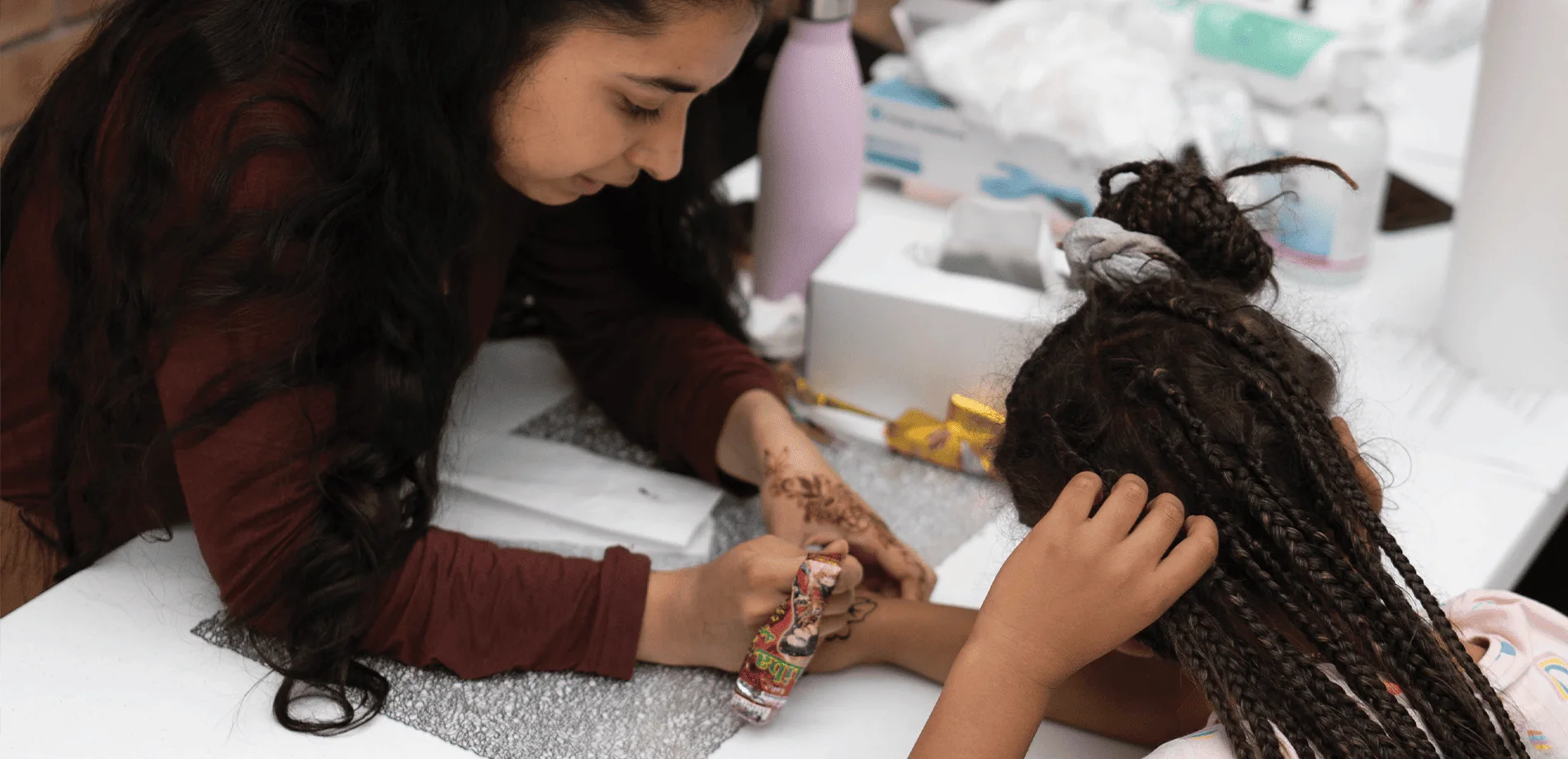 Henna activity at a community event