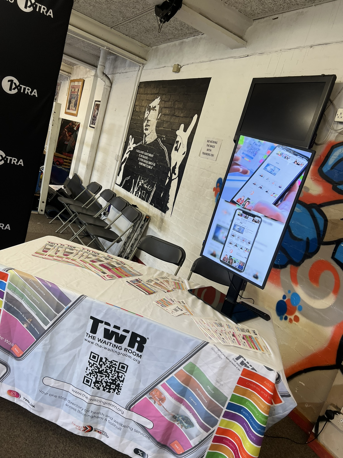 TWR outreach table in a boxing gym